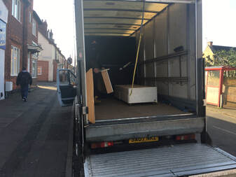 Removals van being loaded during a Loughborough house clearance job